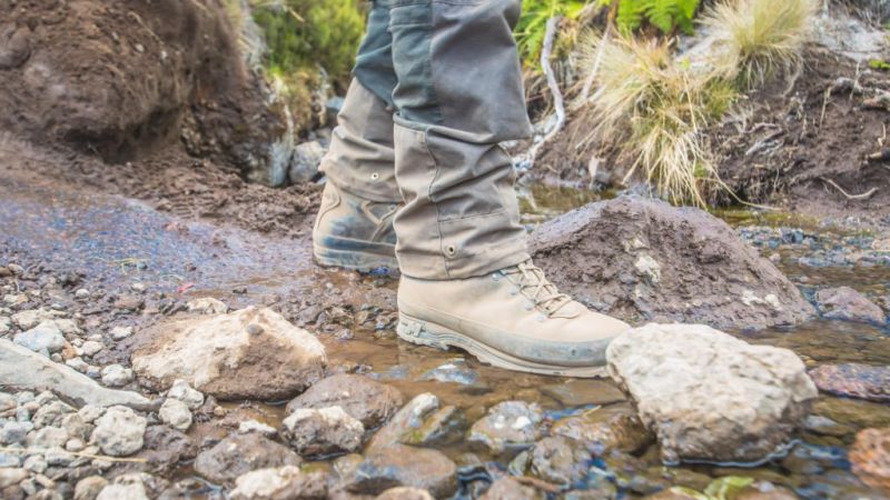 hiking boots in a stream on kilimanjaro