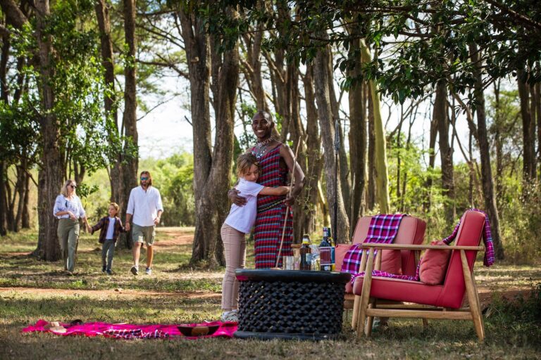 Saruni Basecamp Family Safari hugging guide